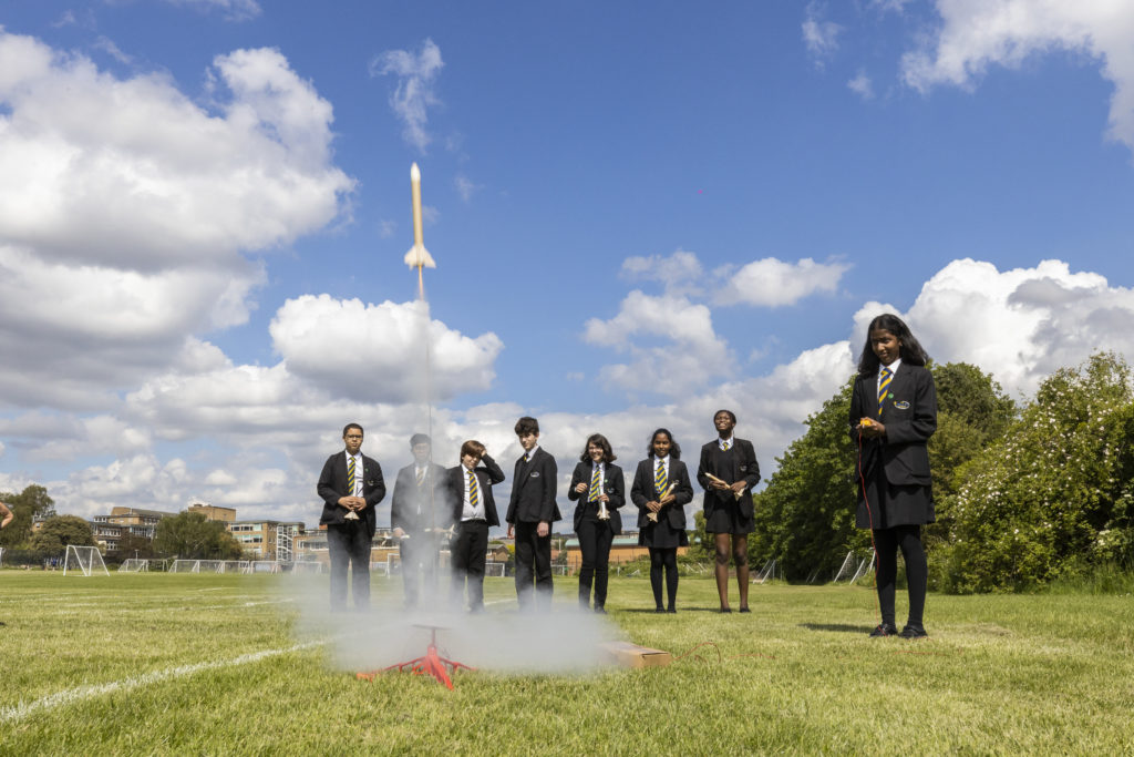Students testing out their rockets on the school field