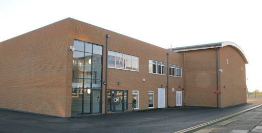 An exterior shot of the Sports Hall building on The Halley Academy grounds.